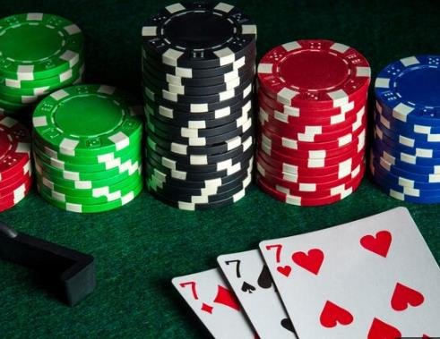 poker table with cards and chips