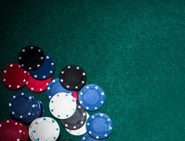 poker chips and cards on casino table