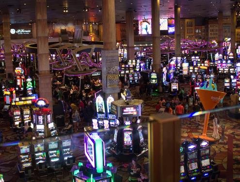 casino floor with slot machines and players